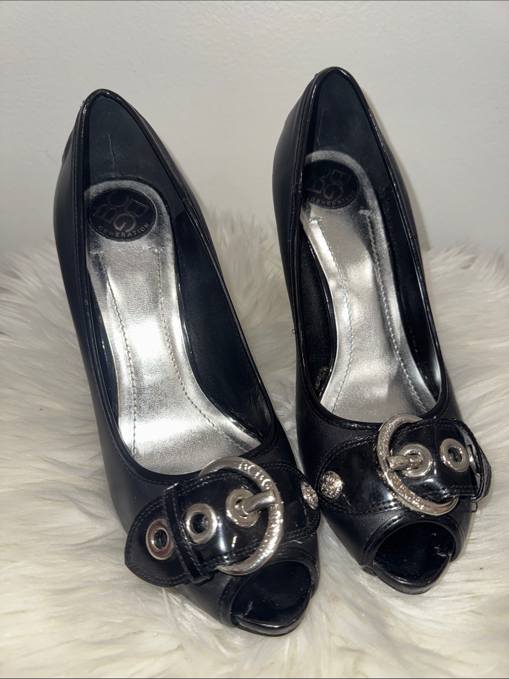 BCBGeneration Black Peep-Toe Heels with Silver Buckle Accents